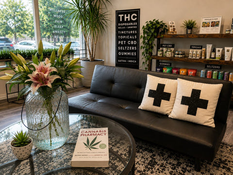 Kind+Life hemp dispensary in Lincoln, Nebraska, with The Cannabis Pharmacy reference book and curated THC, CBD, pet CBD, topicals, gummies and seltzers.